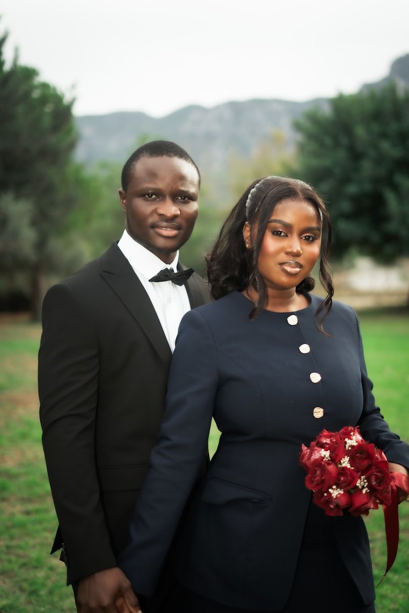 Home A couple in formal attire holding hands outdoors